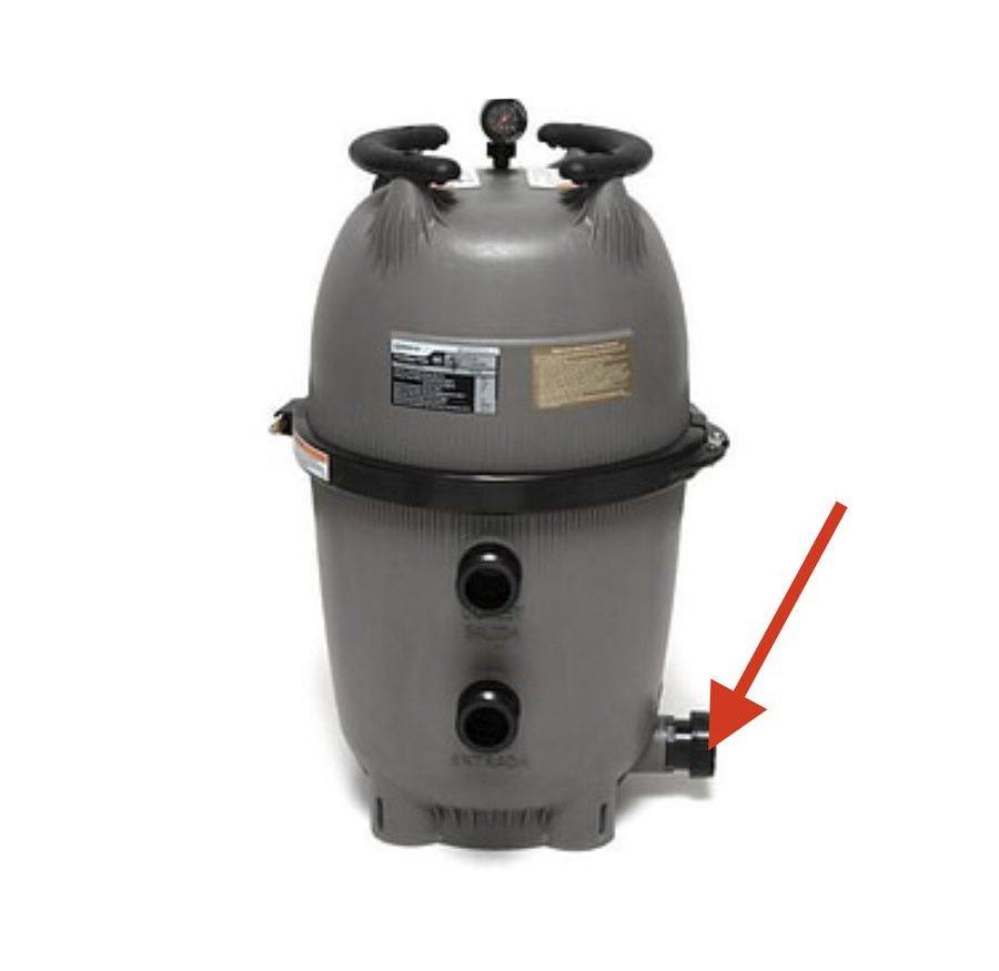 DE filter with drain plug marked by arrow