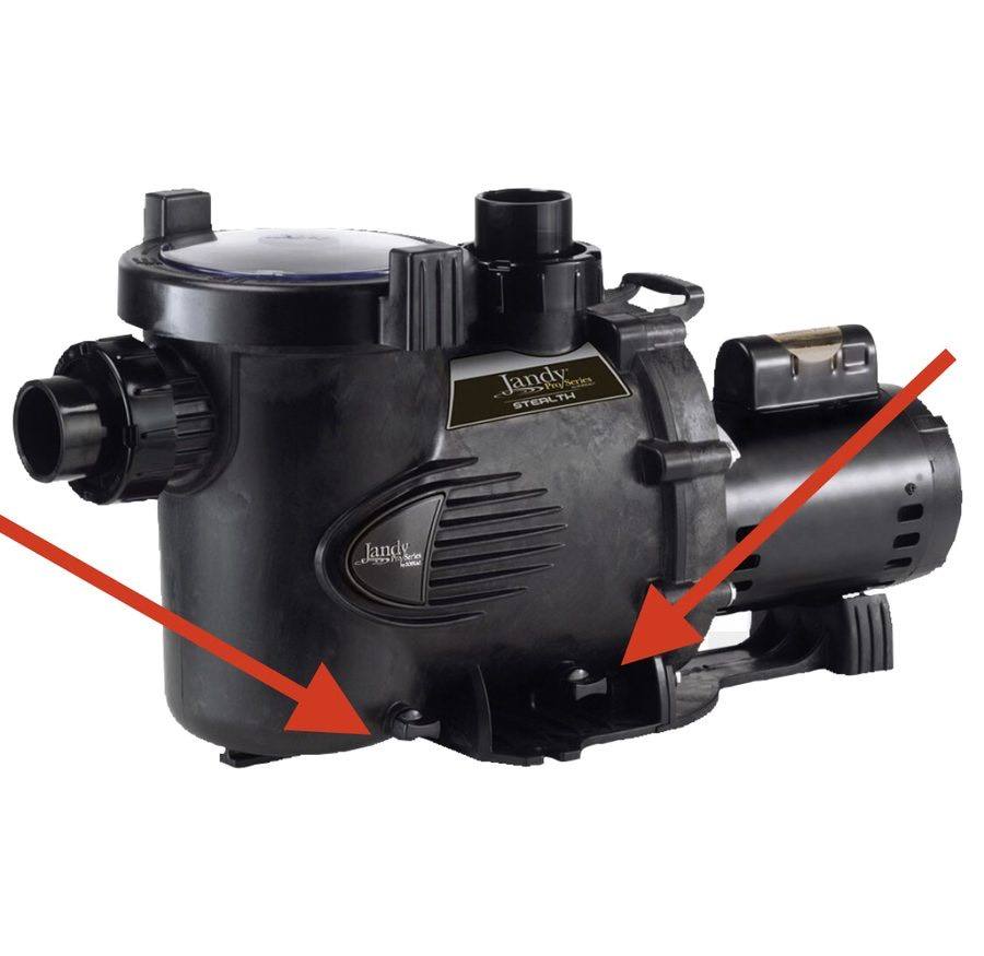 Pool pump with drain plug locations marked by arrows