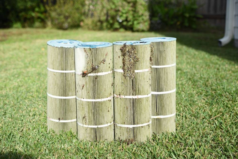 Dirty pool filter cartridges pulled during a filter cleaning