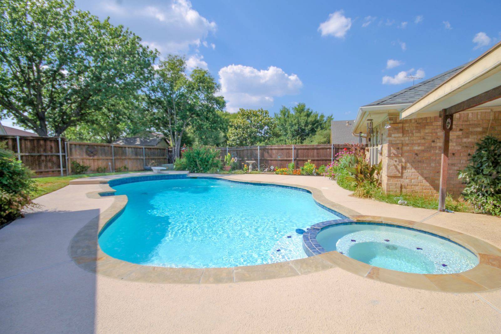 Keller backyard pool kept clear by weekly service