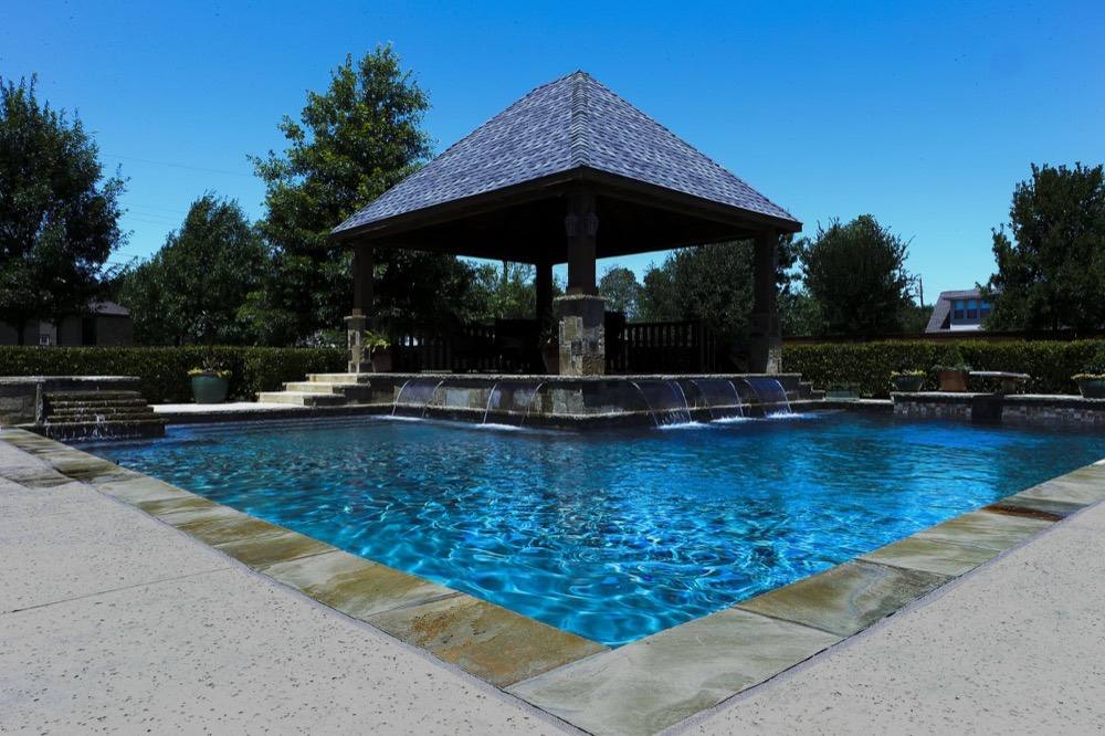 Finished pool and pavilion at dusk
