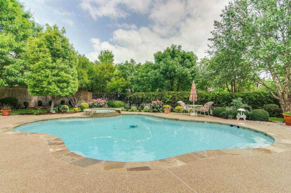 Tree-lined Grapevine pool kept clear through leaf season