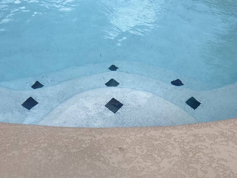 Tanning ledge with diamond tile inlays