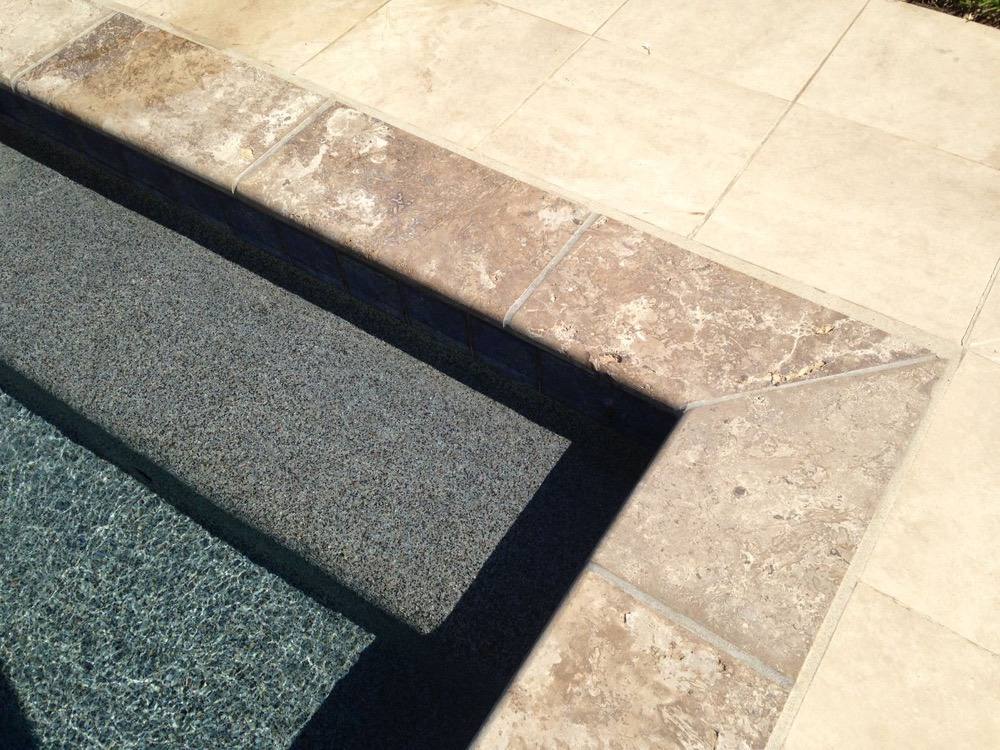 Fresh mastic joint between pool coping and deck