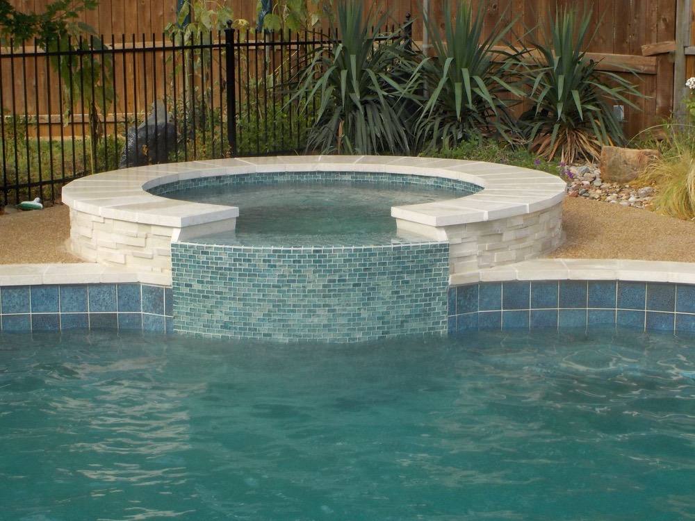 Raised spa with glass tile